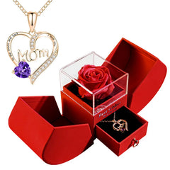 Heart-shaped 'Mom' necklace with purple heart and red rose in a red box.