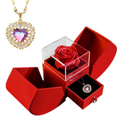 Red jewelry box with a rose and a heart necklace 